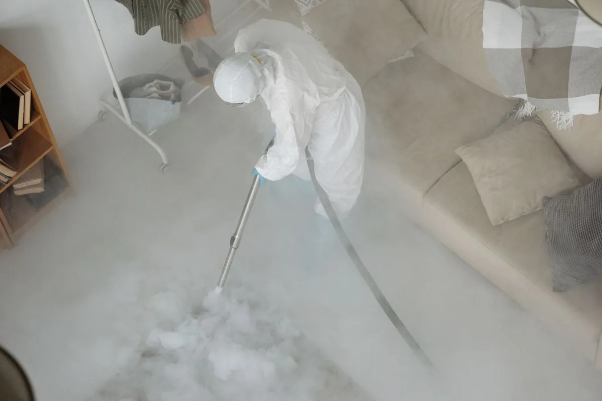 Biohazard cleanup technician in protective equipment, Butte-Silver Bow (balance), MT
